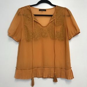 Lulumari sheer pleated beaded tie neck top mustard